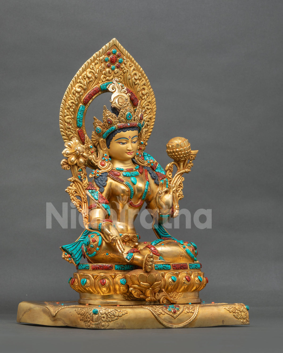 Green Tara statue right side view, gold gilded copper seated on a double lotus pedestal