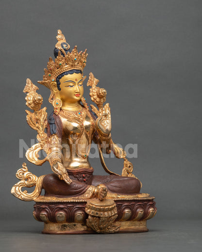 Green Tara statue right side view Lalitasana posture utpala flower.