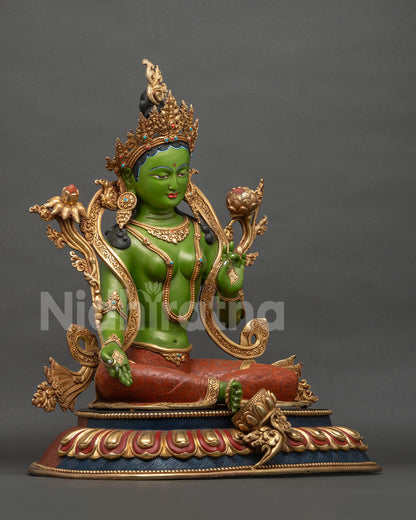 Green Tara statue right side view with Utpala lotus and extended foot on lotus pedestal
