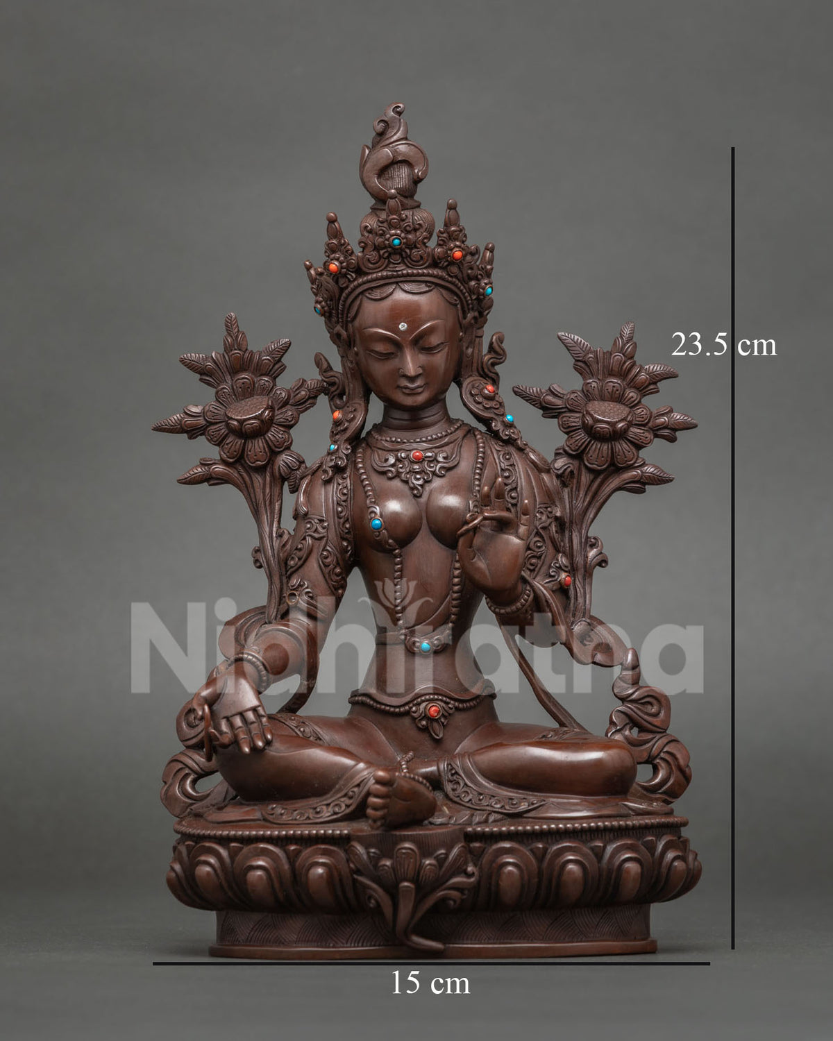 Green Tara statue seated on a lotus in oxidized copper, centerpiece of the Surya Gupta 21 Tara set
