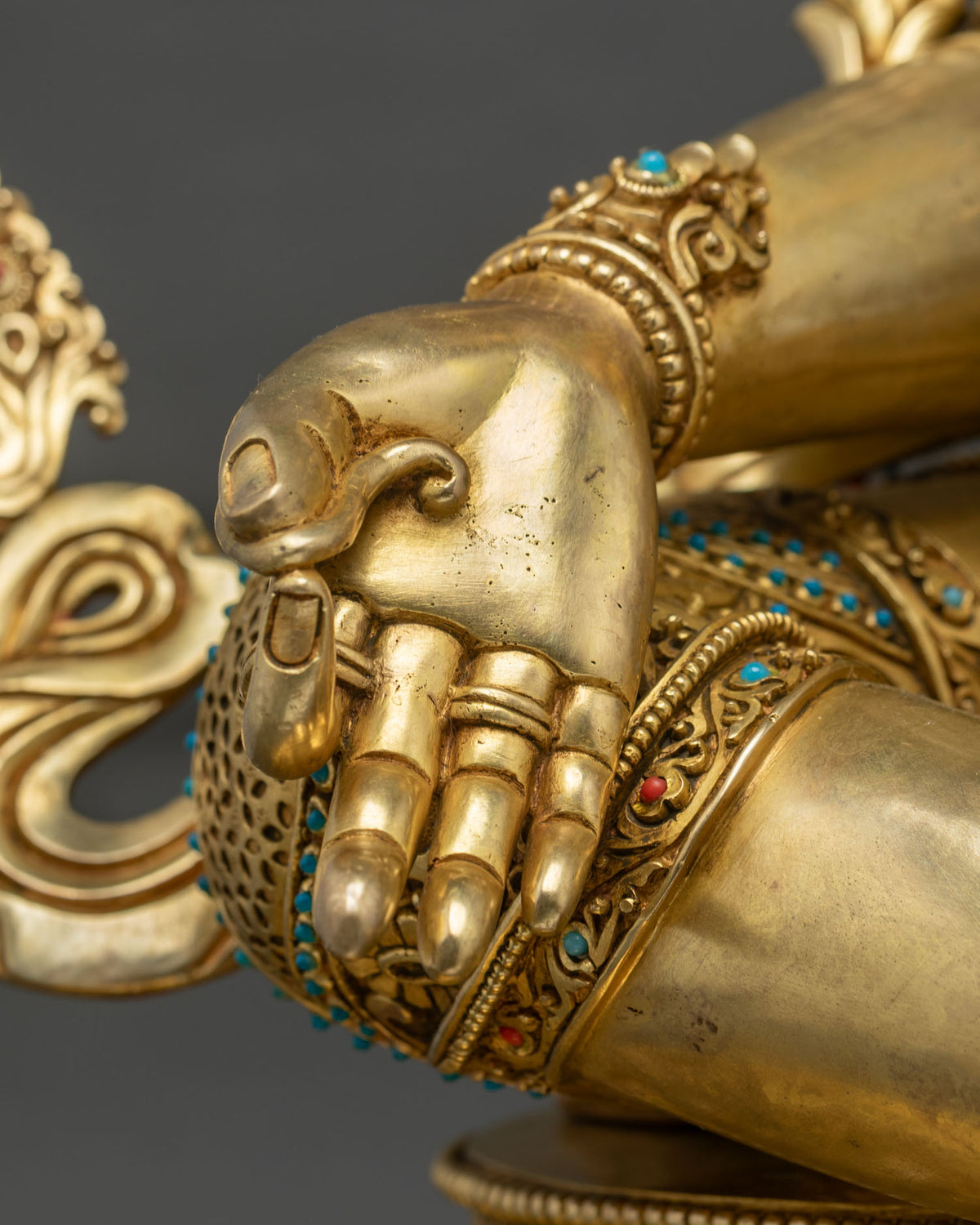 Green Tara statue seated on lotus pedestal with Varada Mudra hand, gold fire-gilded Nepalese sculpture