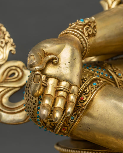 Green Tara statue seated on lotus pedestal with Varada Mudra hand, gold fire-gilded Nepalese sculpture