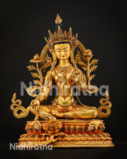Green Tara statue seated on lotus throne symbolizing compassion protection and enlightened action in Buddhist tradition