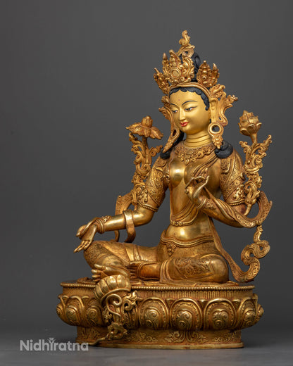 Green Tara statue showing Varada and Abhaya Mudra with ornate five jeweled diadem.