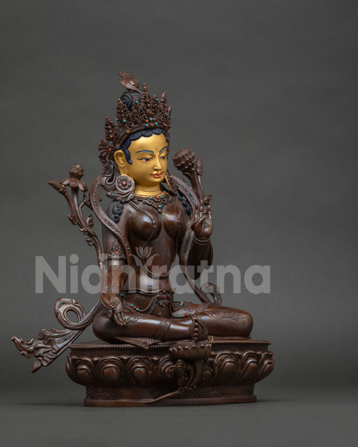 Green Tara Statue showing Varada Mudra and Abhaya Mudra details.