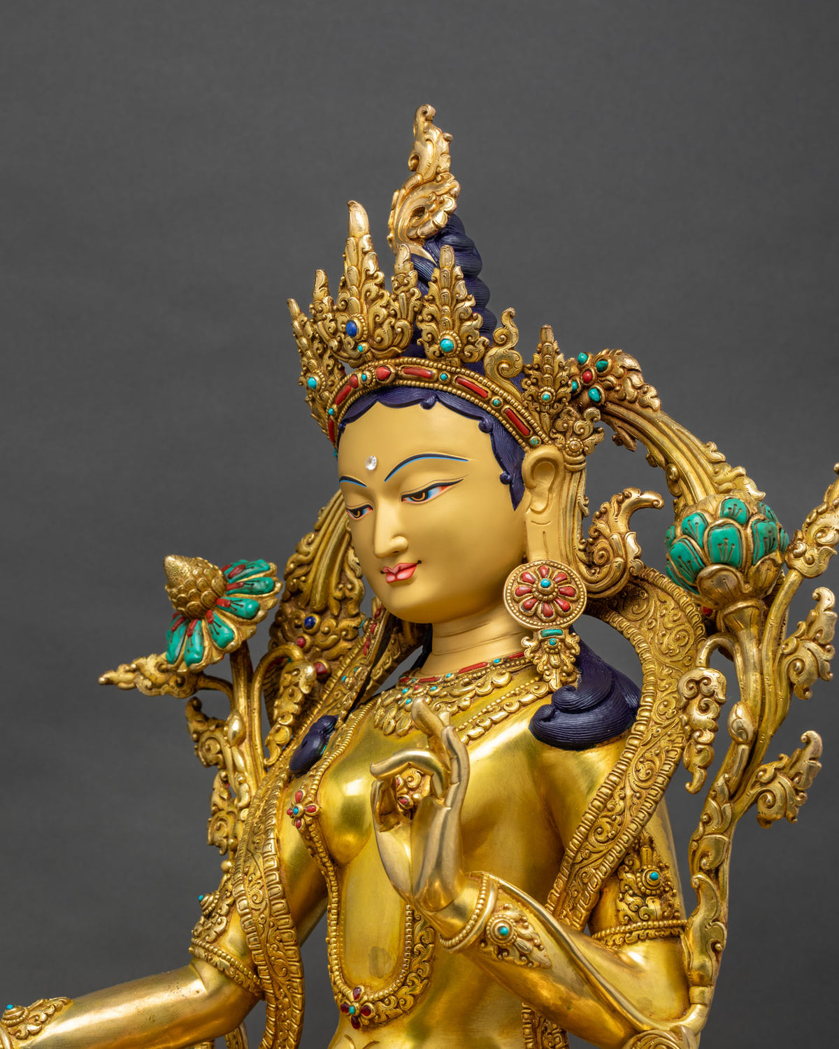Green Tara Statue side close-up, Utpala flower and Varada Mudra detail