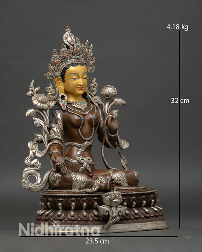 Green Tara statue side view Varada Mudra Abhaya Mudra lotus blossom symbolism Tibetan Buddhist goddess
