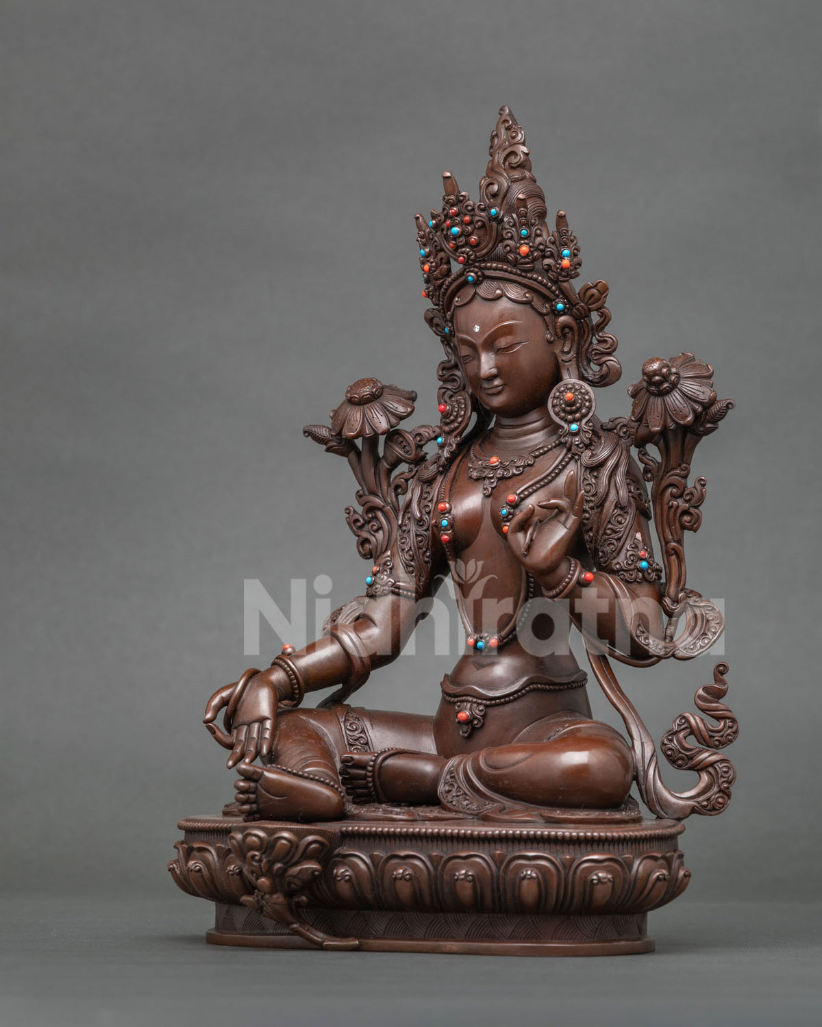 Green Tara Statue Varada Mudra and Abhaya Mudra hand gestures symbolizing blessings protection and fearlessness