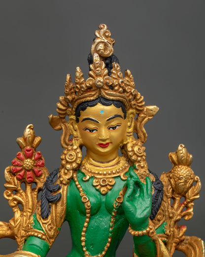 Green Tara statue with 24K gold painted face and gilded details.