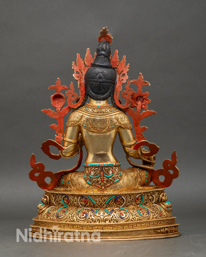 Green Tara statue with utpala flower and intricately carved details