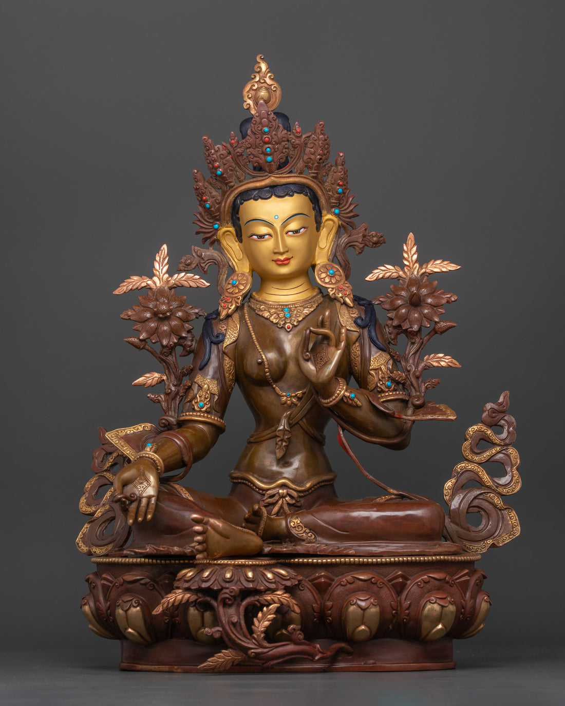 green tara statue with oxidized copper body finish with a 24 karat pure gold face