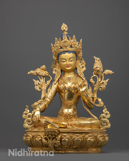 green tara statue front view showing gold-gilded face and lotus seat with detailed ornaments