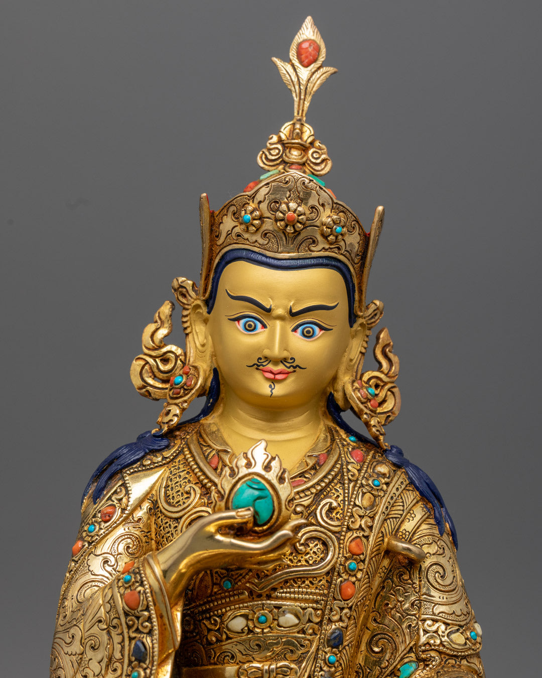 Guru Norlha Statue close up, gold gilded copper prosperity deity sculpture