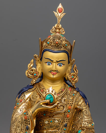 Guru Norlha Statue close up, gold gilded copper prosperity deity sculpture