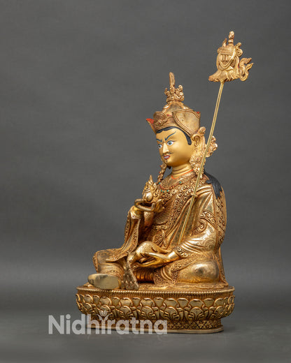 Left profile of Guru Norlha statue with ornate crown and traditional Buddhist ornaments