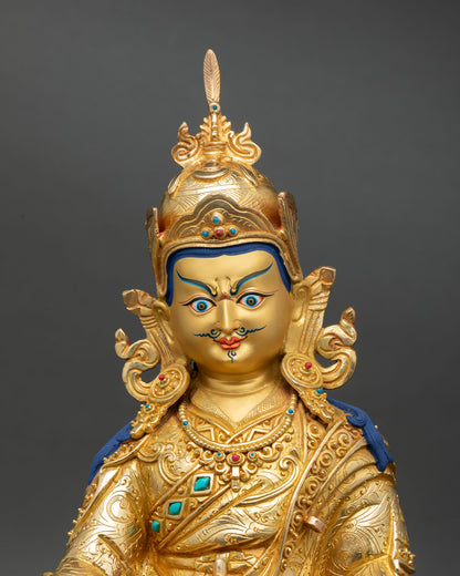 Guru Padmasambhava statue close up gold painted face detail copper craft nepal