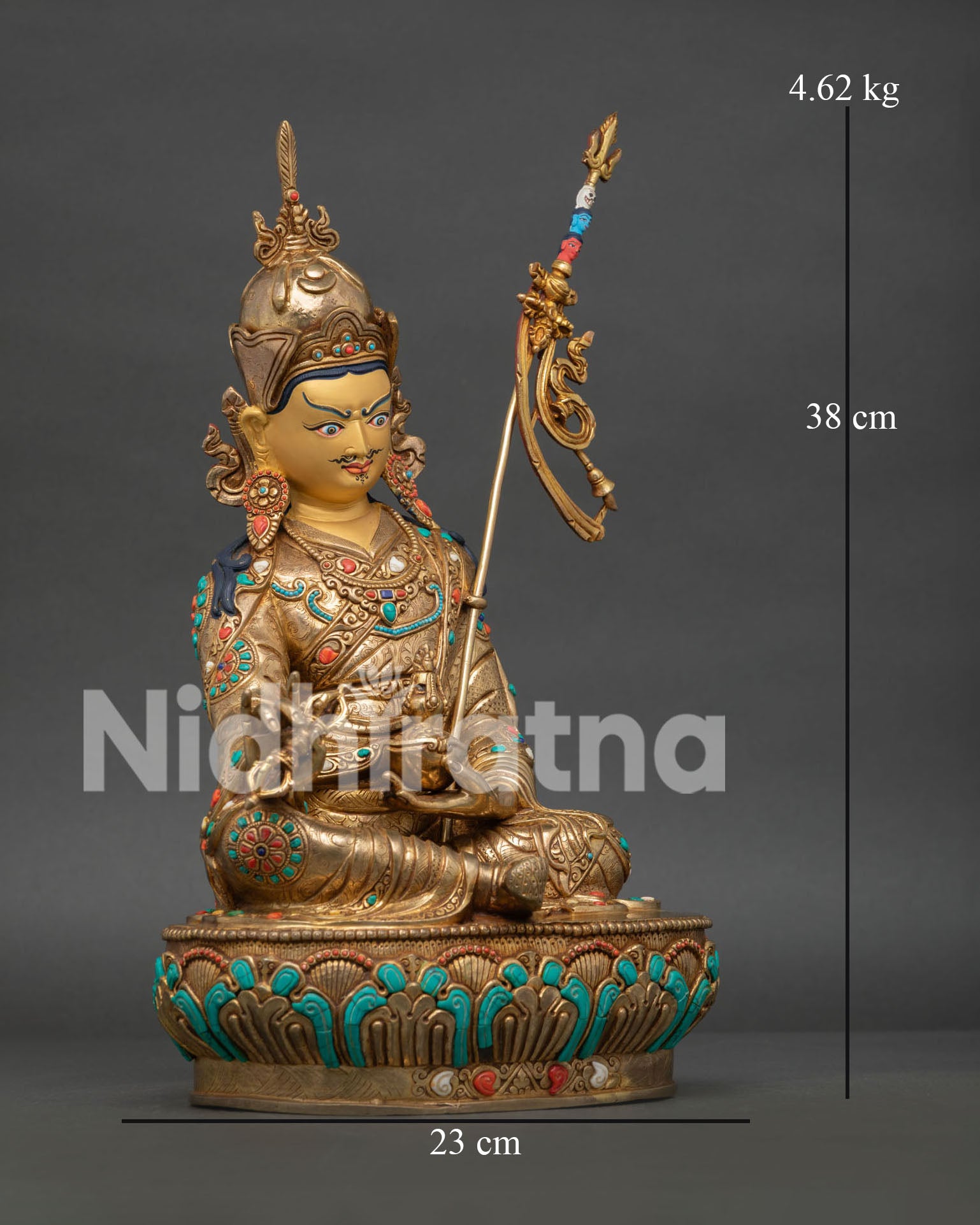 Guru Padmasambhava Statue seated on lotus pedestal holding vajra and kapala