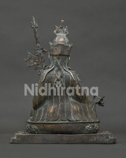 Guru Rinpoche bronze statue from Nepal detailed back view with ornate robes