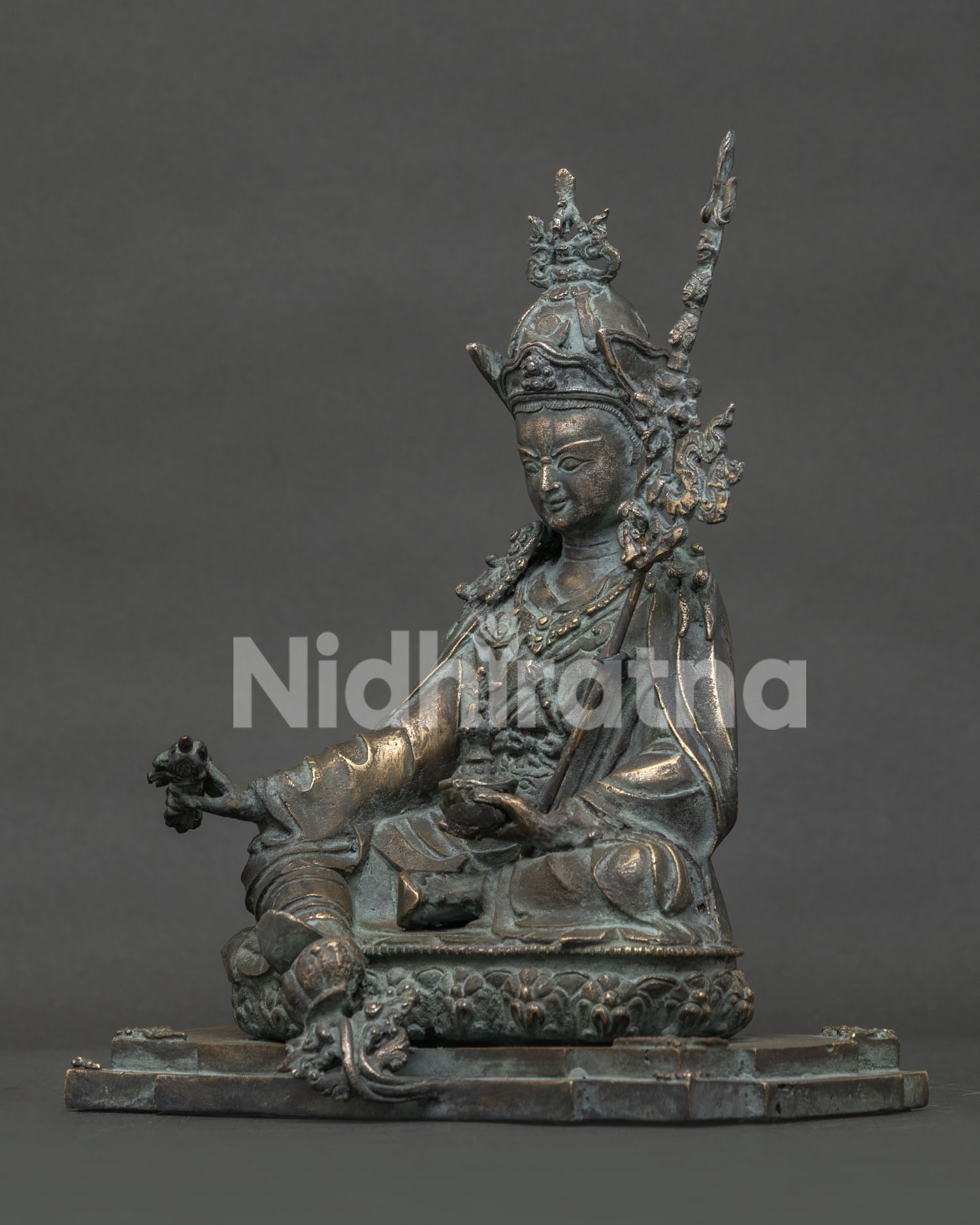 Guru Rinpoche bronze statue left-side view with sacred trident