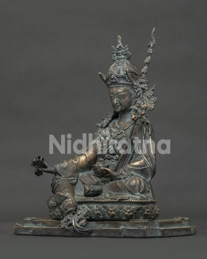 Guru Rinpoche bronze statue left-side view with sacred trident