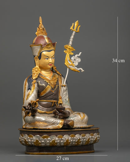 Guru Rinpoche Buddhist sculpture holding vajra and kapala with sacred trident detail