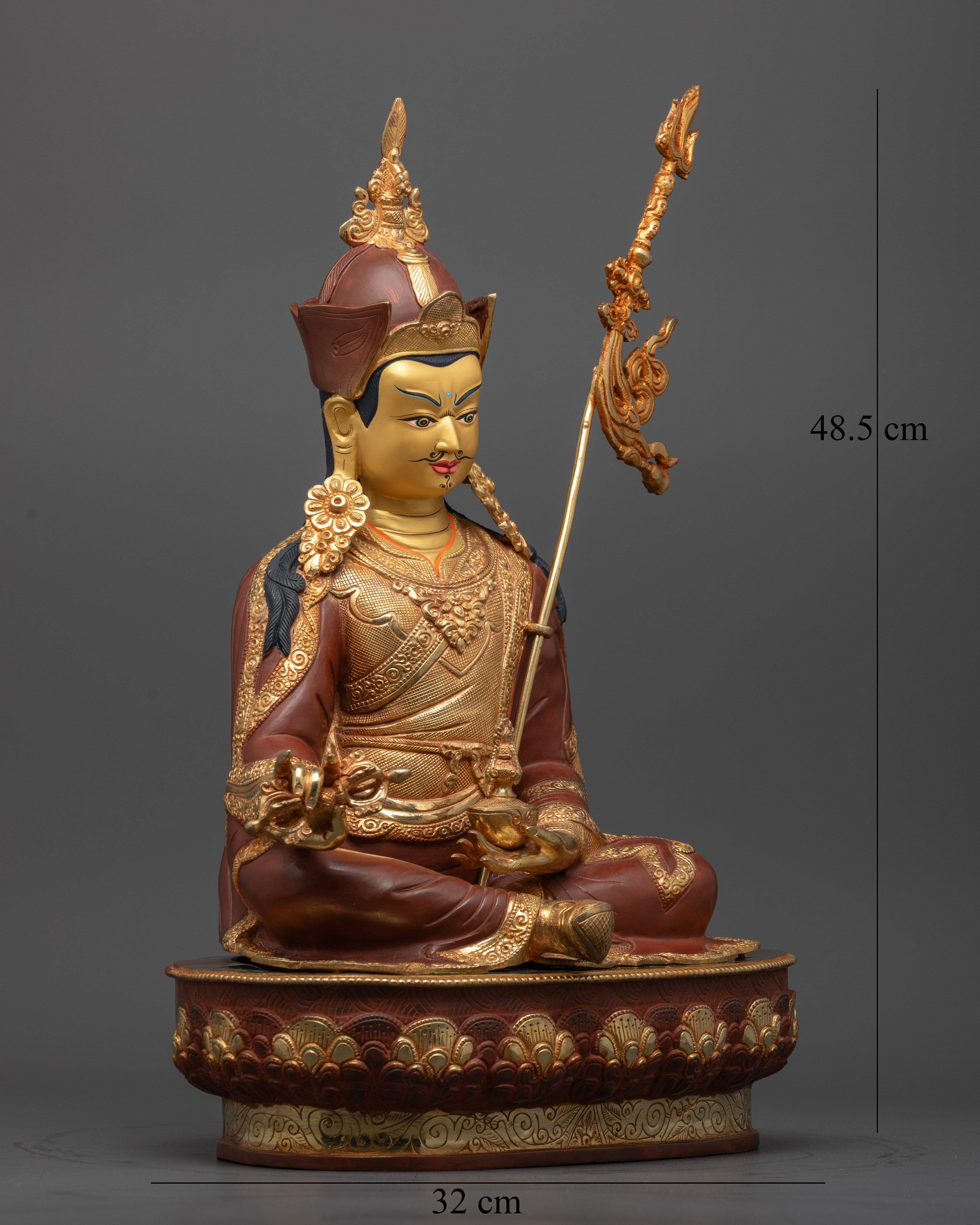 Guru Rinpoche Buddhist sculpture, holding vajra and kapala with sacred trident on shoulder