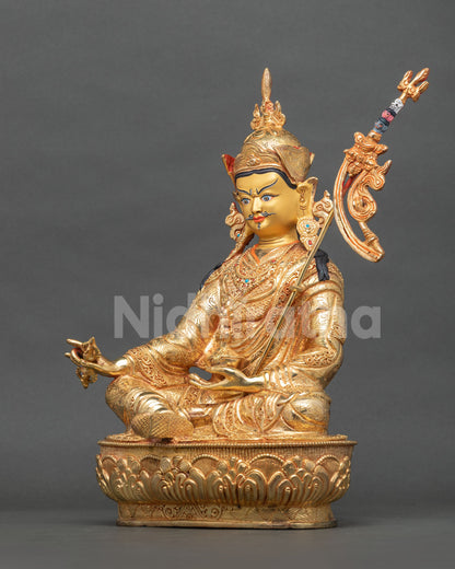 Guru Rinpoche Buddhist sculpture with intricate repoussé work and hand-carved lotus pedestal from Nepal