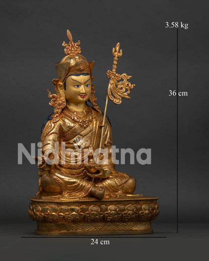 Guru Rinpoche Buddhist Statue holding vajra with skull cup and trident on shoulder