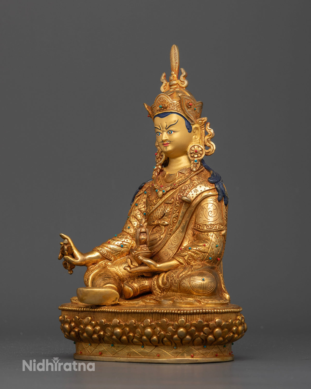 Guru Rinpoche Buddhist Statue with gold painted face red lotus hat and vulture feather