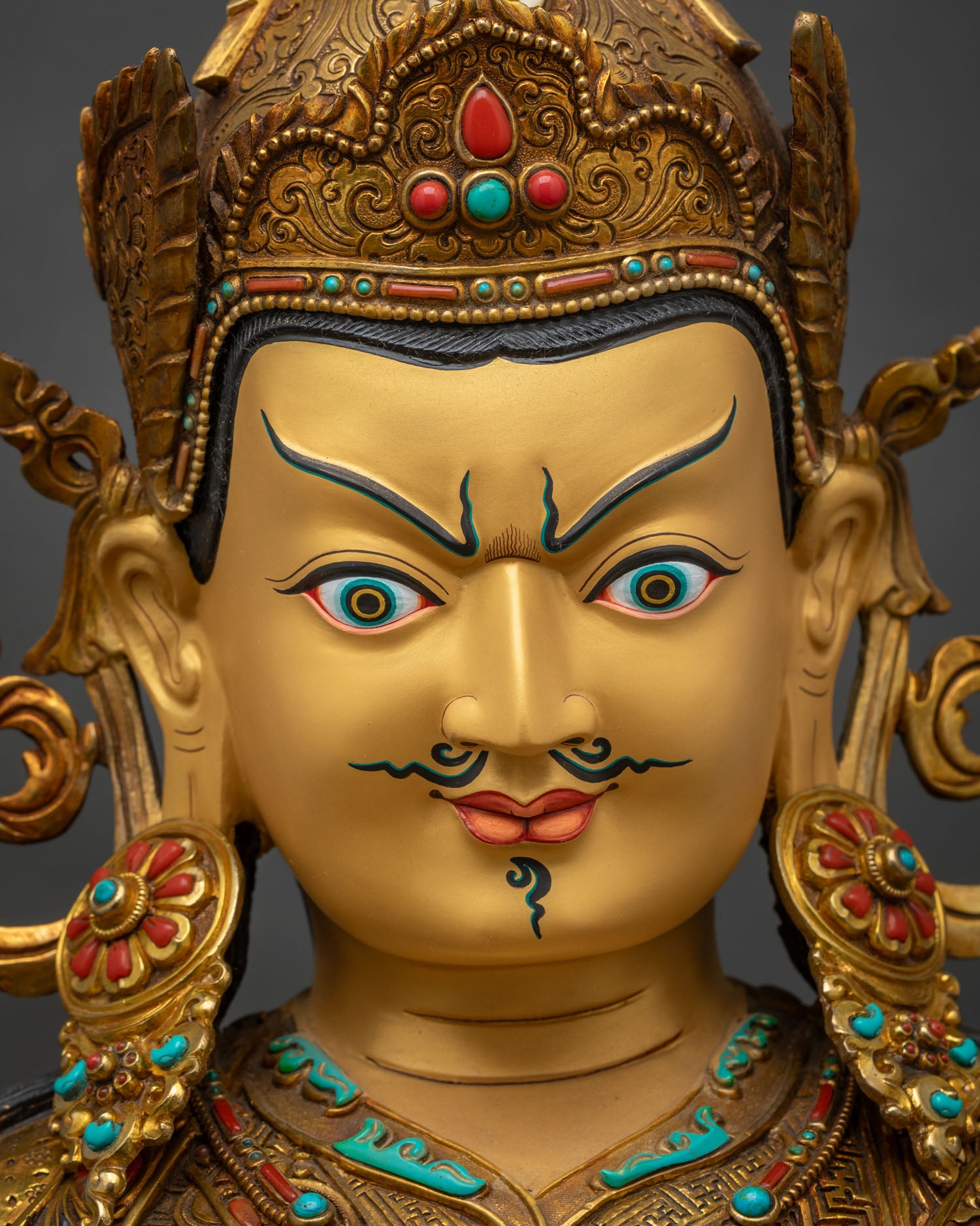 Guru Rinpoche gold-painted face close up, serene fearless expression, 24K gold detail