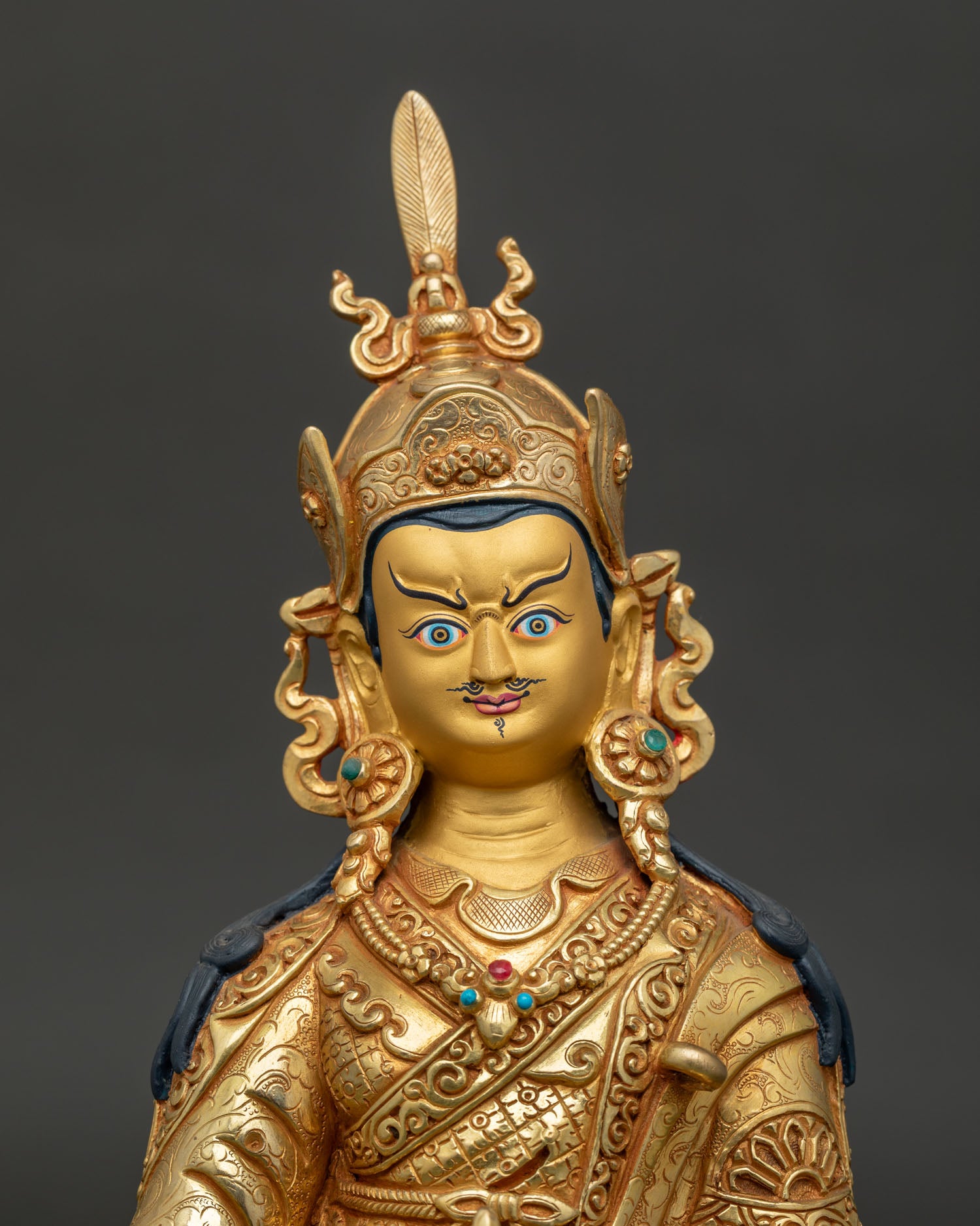 Guru Rinpoche Gold-Painted Face with Red Lotus Hat and Semi-Wrathful Expression.