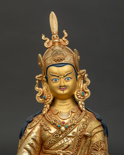 Guru Rinpoche Gold-Painted Face with Red Lotus Hat and Semi-Wrathful Expression.