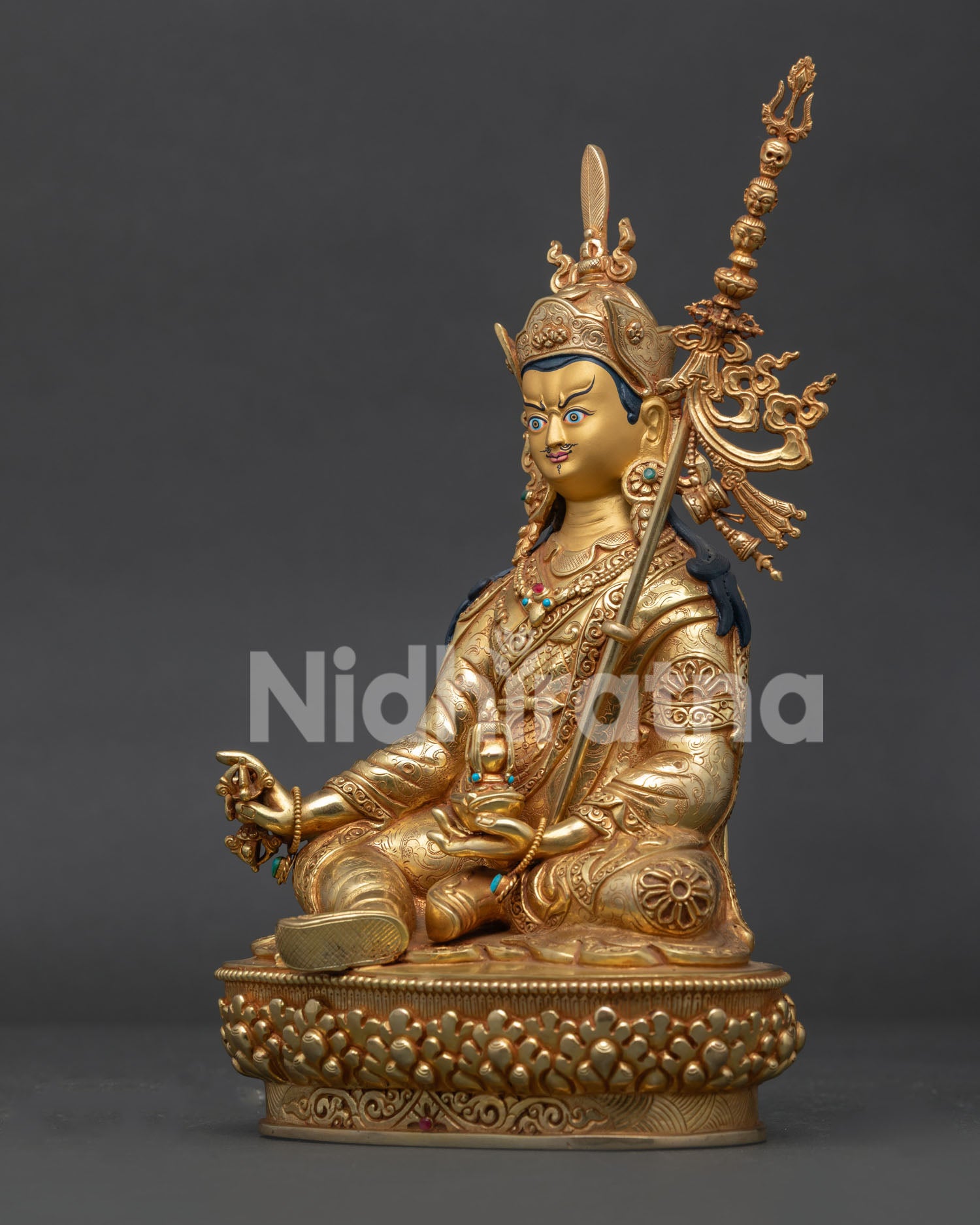 Guru Rinpoche Holding Vajra and Kapala with Khatvanga Detailed Side View.