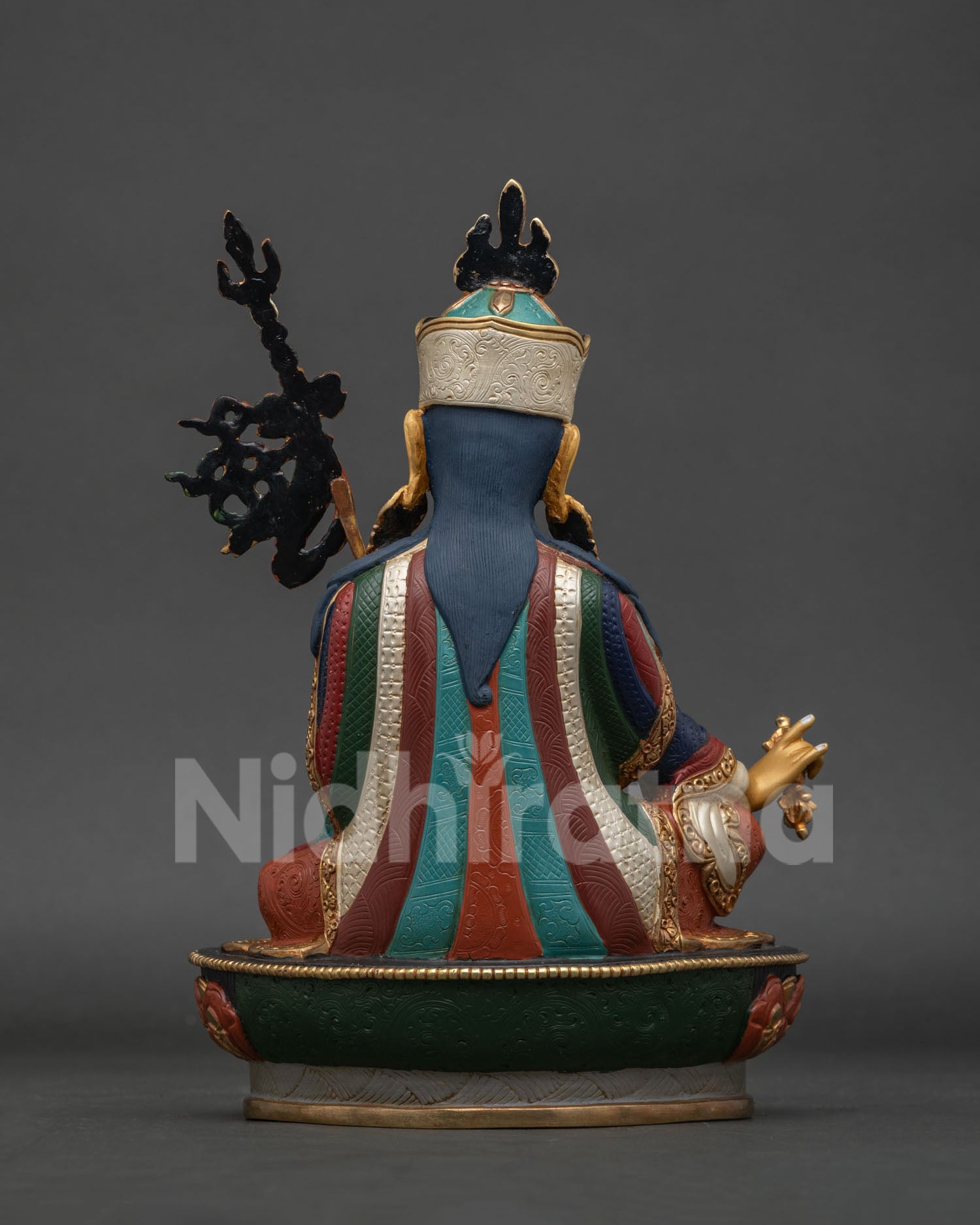 Guru Rinpoche Padmasambhava statue back view showing detailed copper craftsmanship and robes