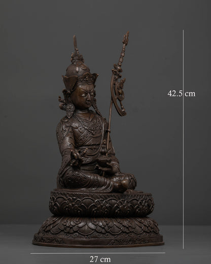 Guru Rinpoche seated on double lotus pedestal holding vajra and skull cup