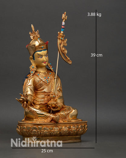 Guru Rinpoche side view seated balanced posture khatvanga staff shoulder gold gilded copper statue