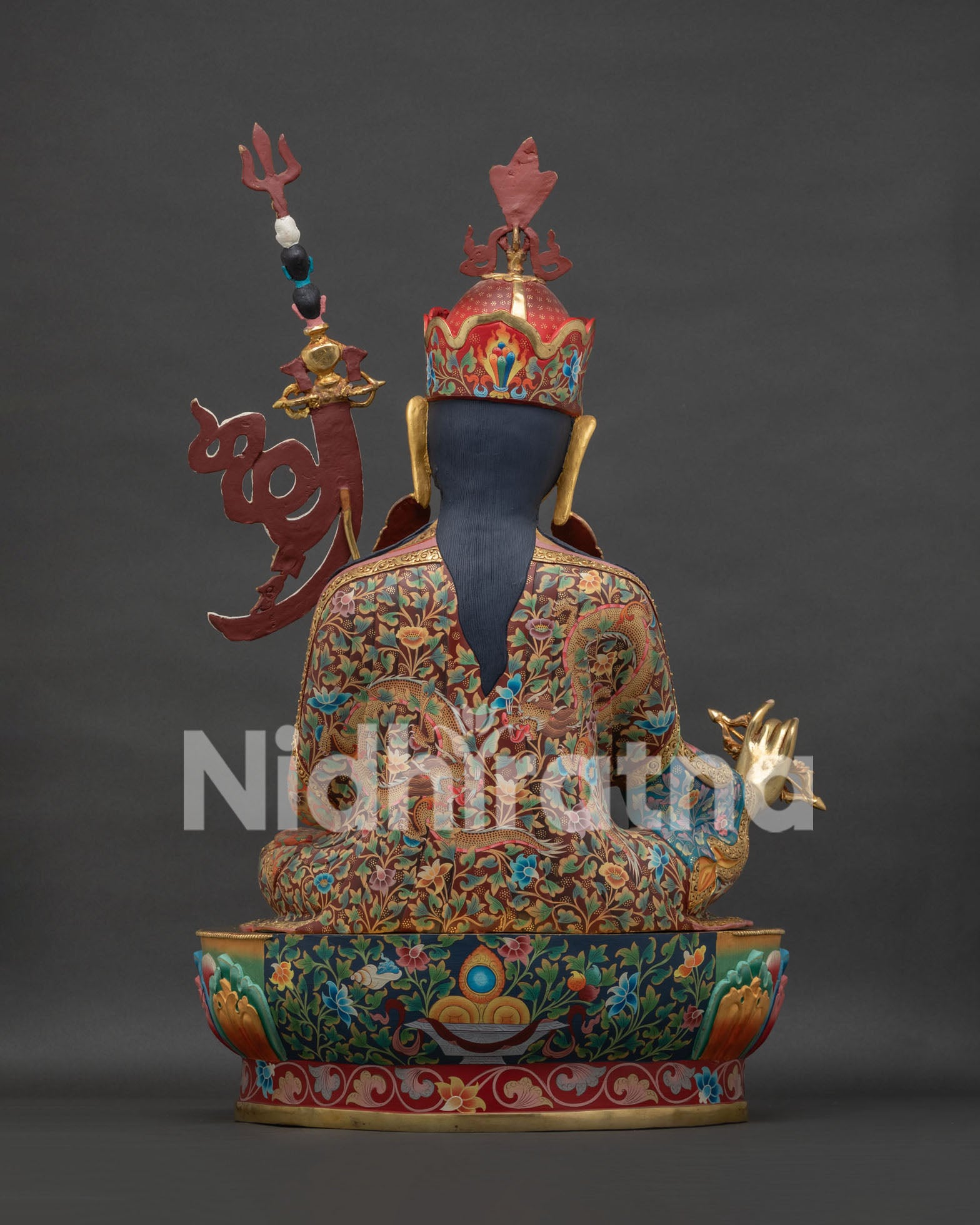 Guru Rinpoche statue back view displaying ornate robes and finely detailed lotus throne craftsmanship