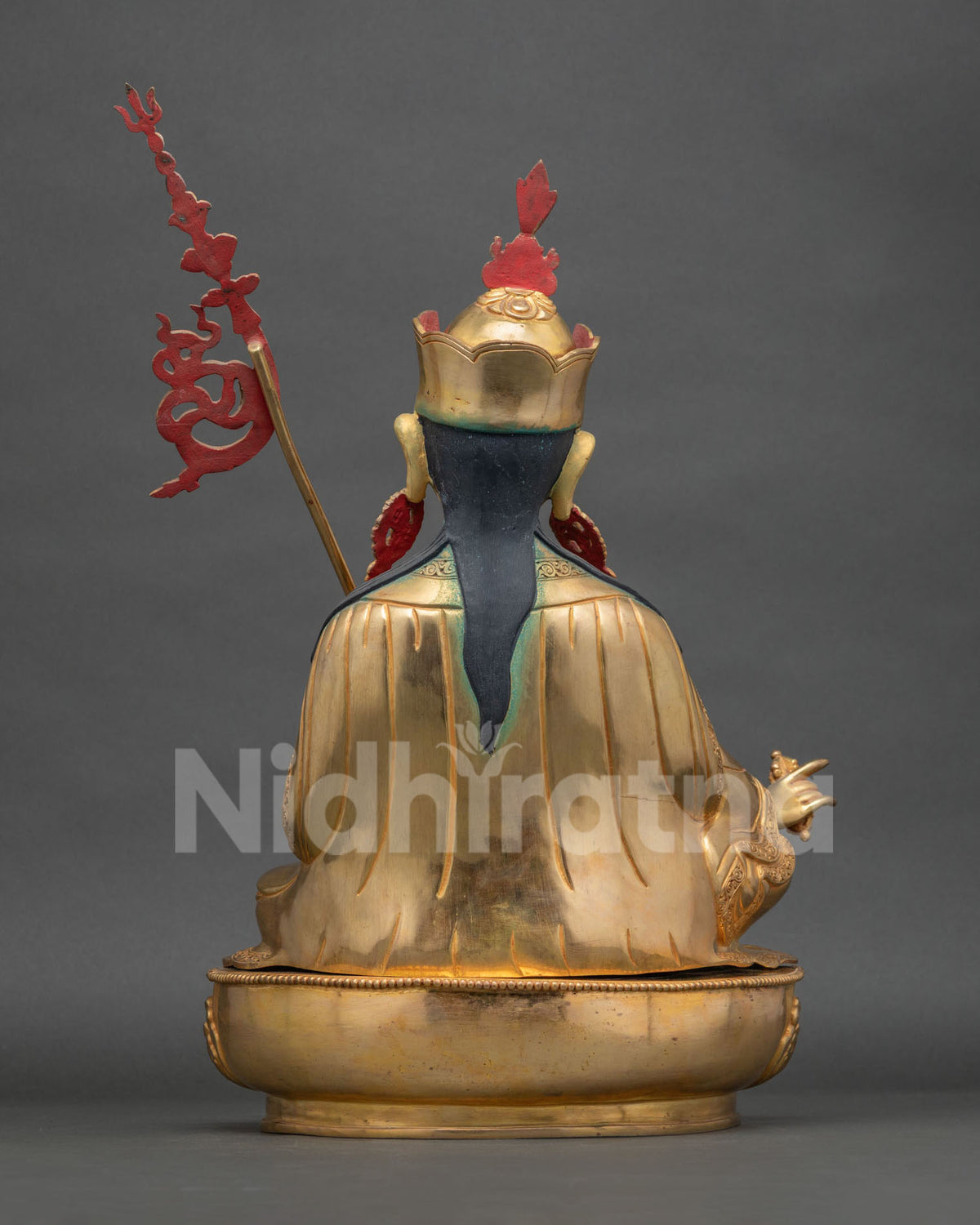 Guru Rinpoche Statue back view gold fire gilded copper sculpture.