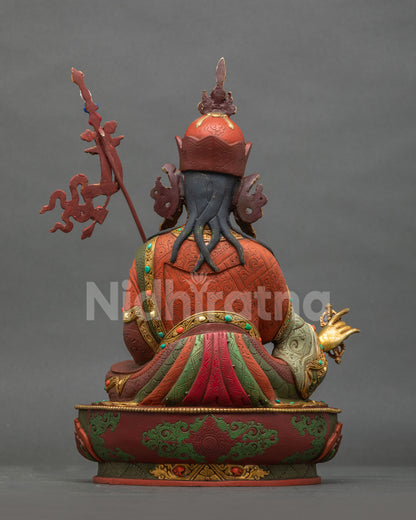 Guru Rinpoche Statue back view hand carved floral robes semi precious stones.