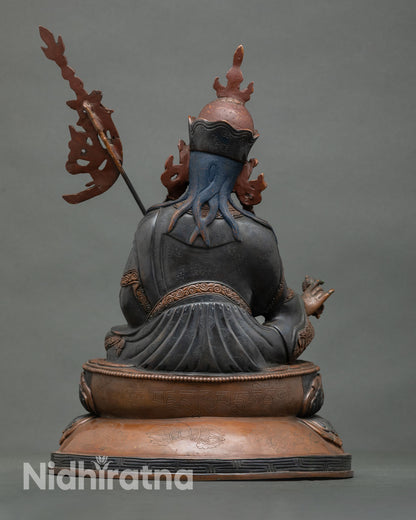 Guru Rinpoche statue back view Himalayan Buddhist sculpture lotus seat sacred altar decor Vajrayana art