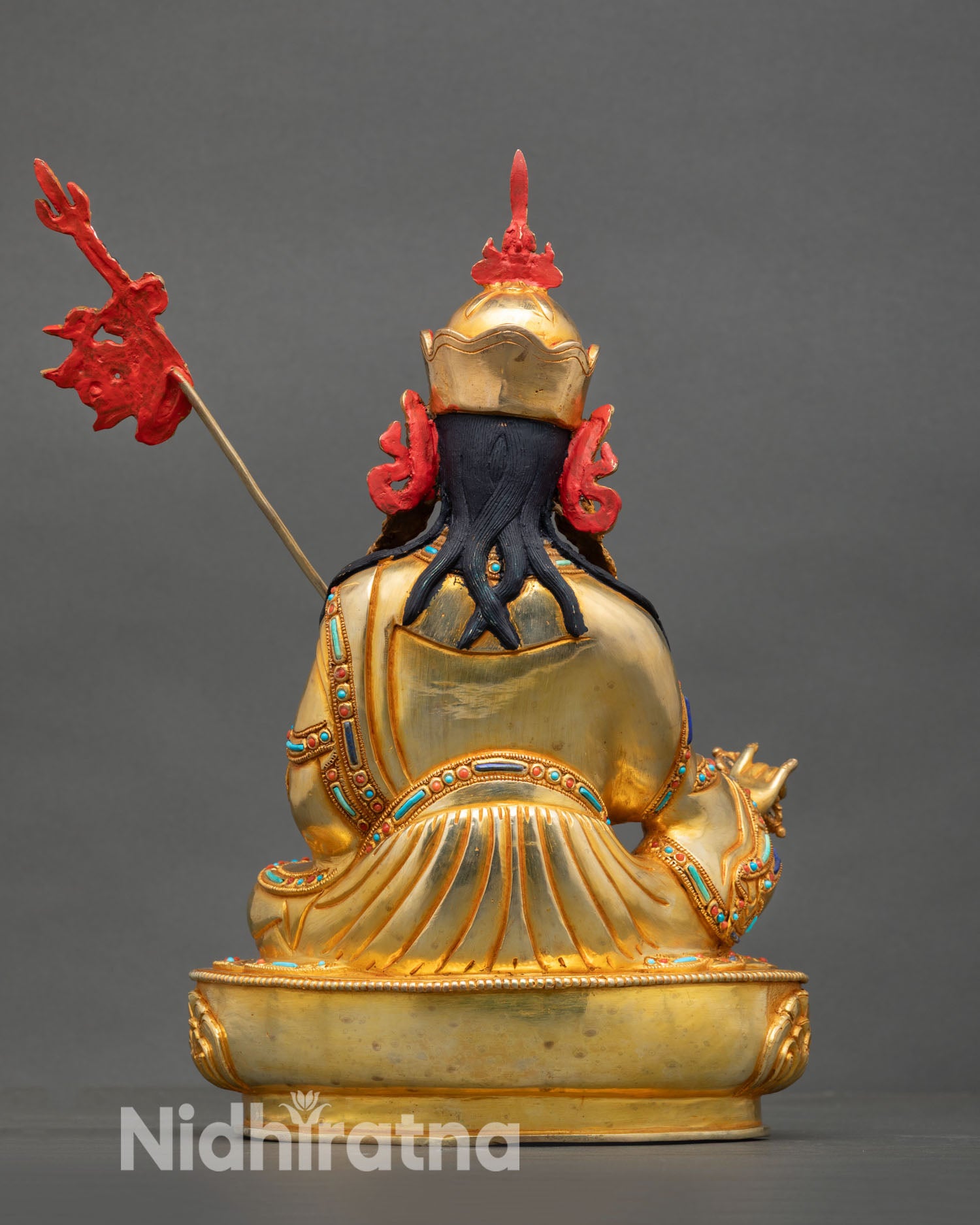 Guru Rinpoche statue back view Himalayan Vajrayana sculpture ornamental detailing spiritual altar home decor Buddhist statue