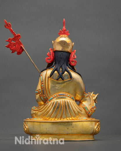 Guru Rinpoche statue back view Himalayan Vajrayana sculpture ornamental detailing spiritual altar home decor Buddhist statue