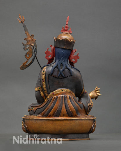 Guru Rinpoche statue back view intricate carving oxidized gold gilded finish sacred altar decor spiritual wisdom compassion deity statue