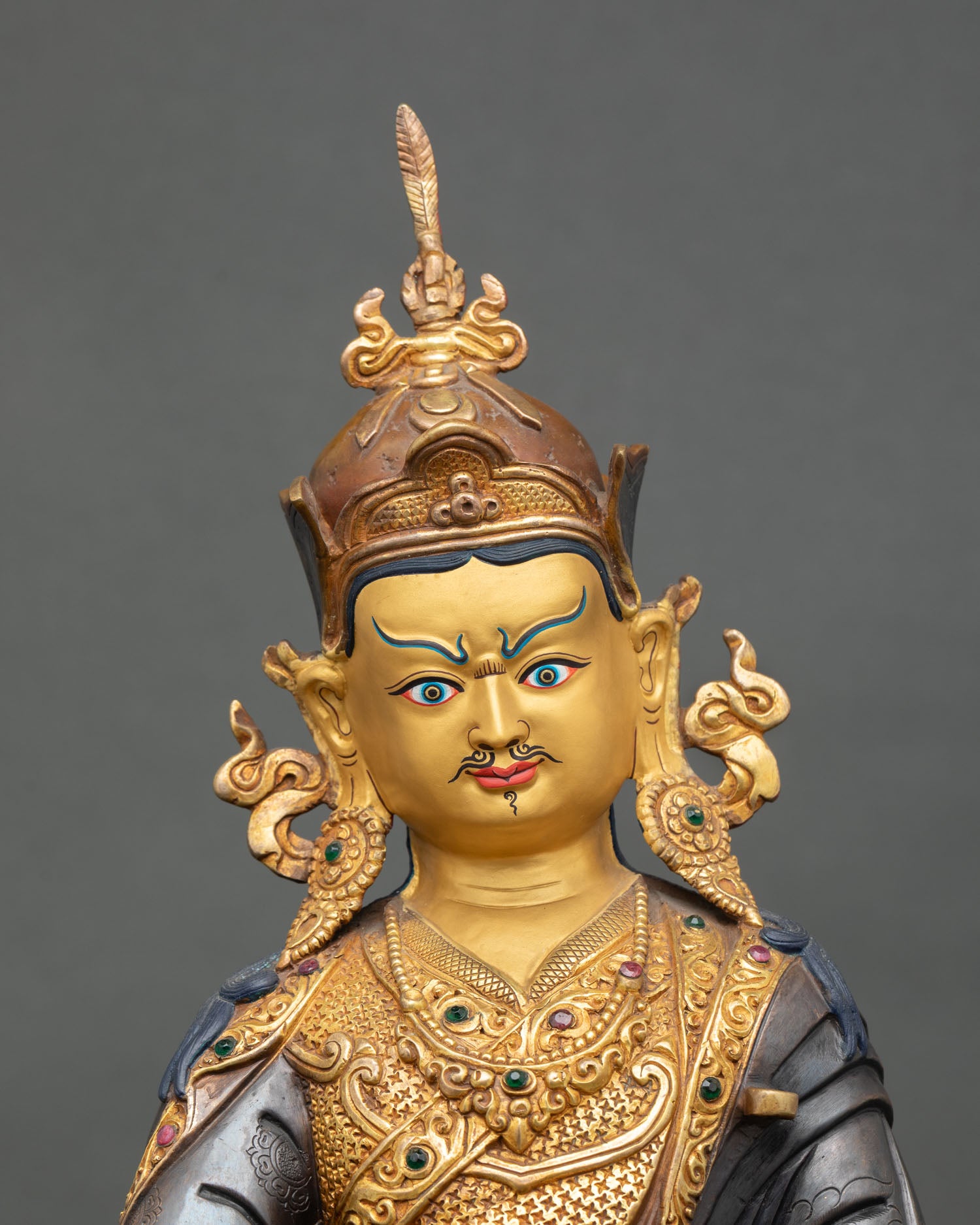 Guru Rinpoche statue close up detail vajra skull cup nectar khatvanga staff lotus hat feather Tibetan Buddhist tantric master art