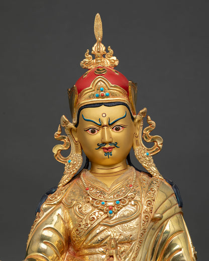 guru rinpoche statue close up, lost wax copper buddhist sculpture with gold detailing