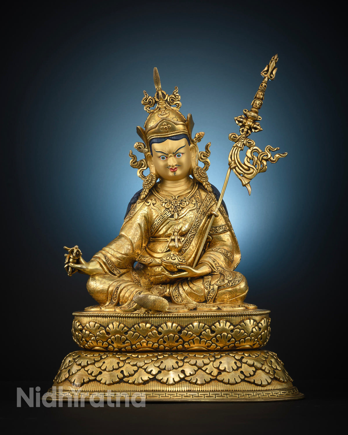 Guru Rinpoche statue copper gold fire gilded front view.
