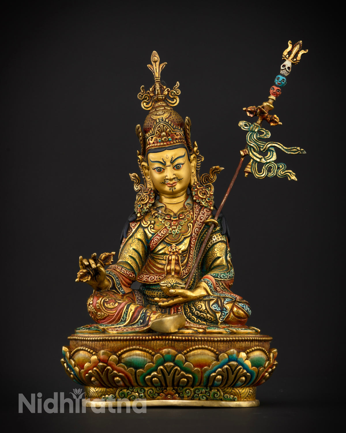 Guru Rinpoche statue crafted from copper with a gold fire gilded finish and multicolor lotus pedestal.