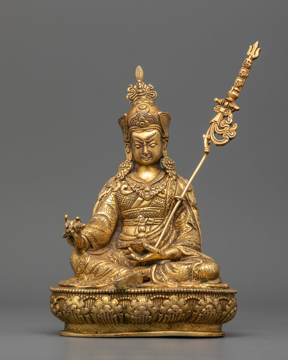 Guru Rinpoche statue copper sculpture with radiant gold fire gilding.