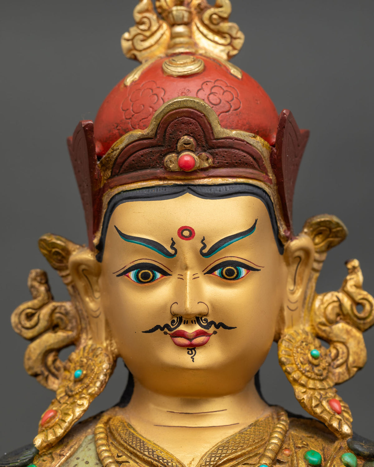Guru Rinpoche Statue detail vajra skull cup semi precious stones lotus throne.