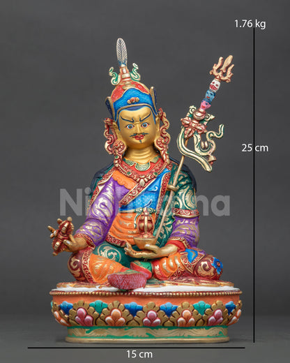 Guru Rinpoche statue from Patan Nepal with gold painted face and colorful lotus pedestal.